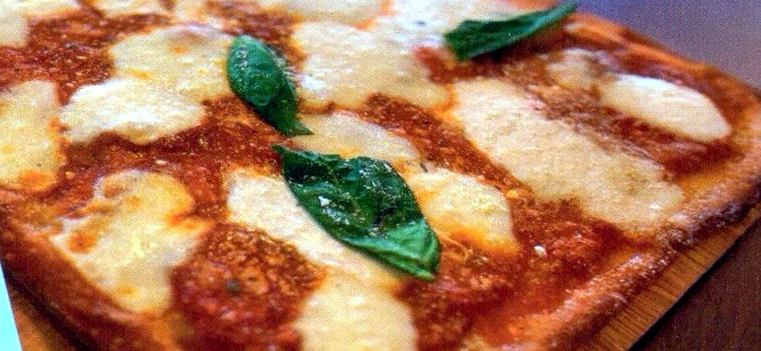 Artisan flatbread with fresh mozzarella and basil